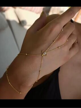 Anthropologie Gold Hand Chain Bracelet with Eye Motif